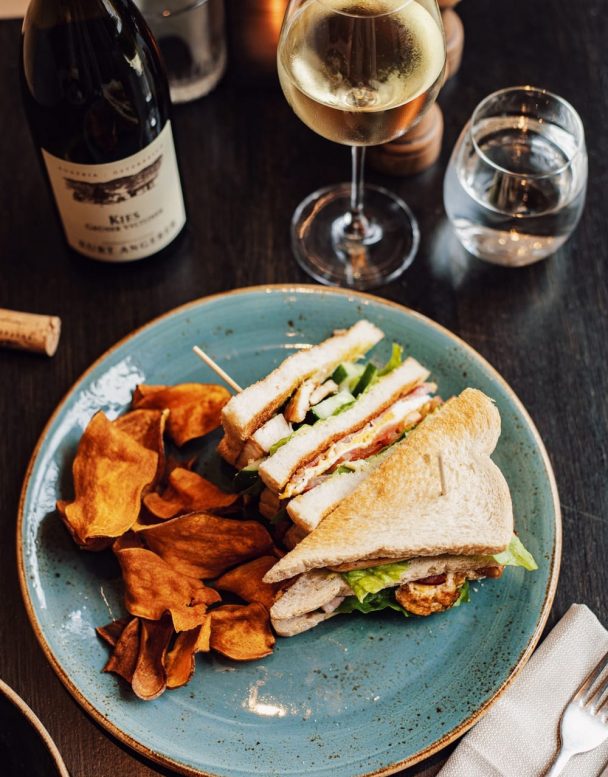 Pillars Bar & Kitchen Lunch Dish with Club Sandwich and Wine